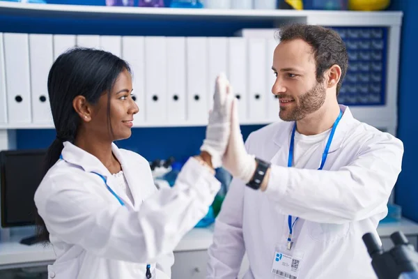 Man Woman Scientists Smiling Confident High Five Laboratory — Zdjęcie stockowe