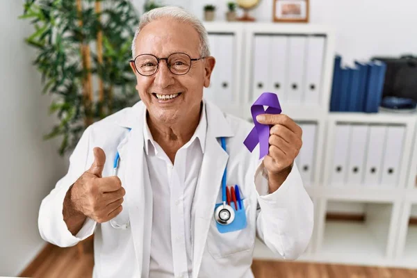 Senior Doctor Man Holding Purple Ribbon Awareness Smiling Happy Positive — Stock Photo, Image