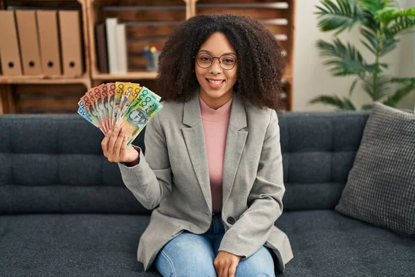 Young African American Woman Holding Australian Dollars Consultation Office Looking — Stockfoto