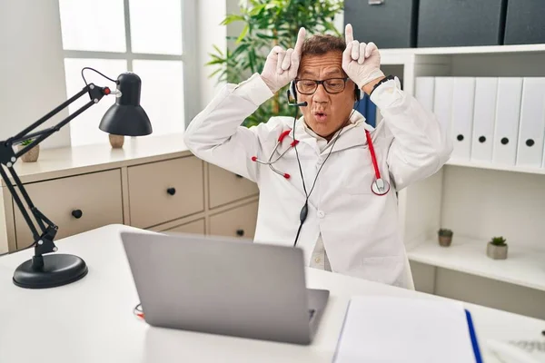 Senior Doctor Man Working Online Appointment Doing Funny Gesture Finger — Stock Photo, Image