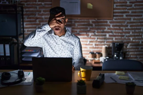 Young Hispanic Man Working Office Night Peeking Shock Covering Face — Stock Photo, Image