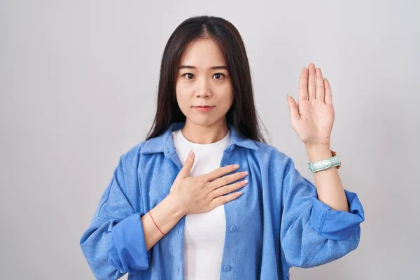 Young Chinese Woman Standing White Background Swearing Hand Chest Open —  Fotos de Stock