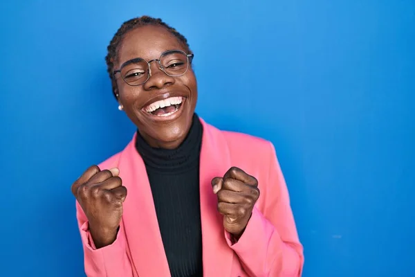 Beautiful Black Woman Standing Blue Background Celebrating Surprised Amazed Success — Stockfoto