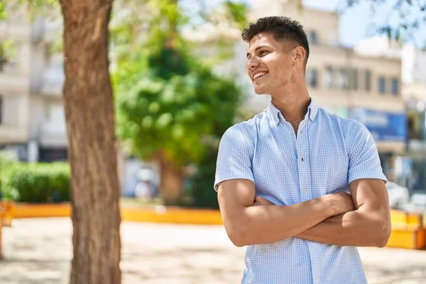 Young Hispanic Man Smiling Confident Standing Arms Crossed Gesture Park — стоковое фото