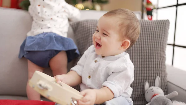 Adorable Toddler Holding Tambourine Sitting Sofa Christmas Tree Home — Stock Photo, Image