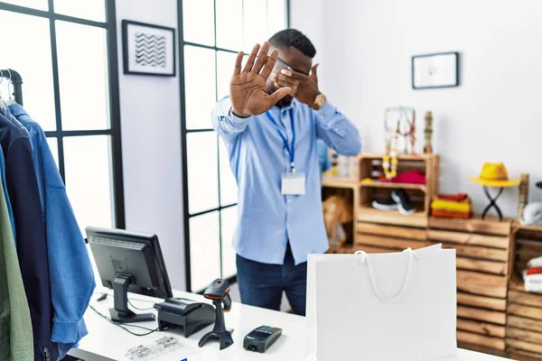 Young African Man Working Manager Retail Boutique Covering Eyes Hands — Photo