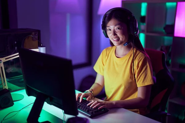 stock image Chinese woman streamer smiling confident using computer at gaming room