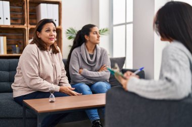 Three woman mother and daughter having psychology therapy at psychology center