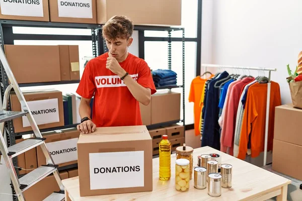 Young Caucasian Man Volunteer Holding Donations Box Feeling Unwell Coughing — Stockfoto