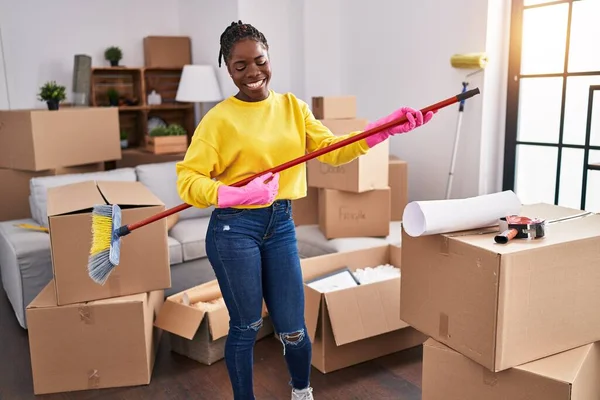African American Woman Playing Mop Guitar Cleaning New Home — Stockfoto