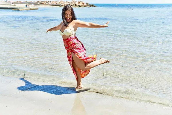 Young Beautiful Hispanic Woman Tourist Wearing Bikini Dancing Seaside — Stock Photo, Image