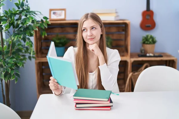 Young Caucasian Woman Reading Books Home Serious Face Thinking Question — Foto de Stock