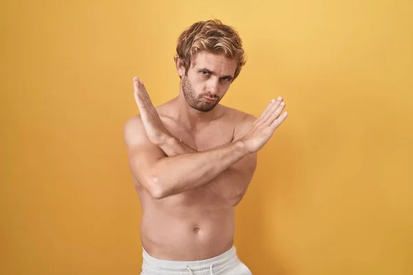 Caucasian Man Standing Shirtless Wearing Sun Screen Rejection Expression Crossing — Zdjęcie stockowe