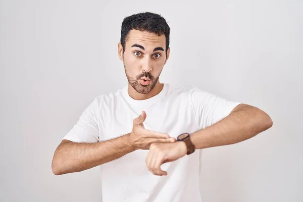 Handsome Hispanic Man Standing White Background Hurry Pointing Watch Time — 图库照片