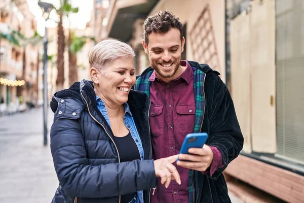 Mother Son Smiling Confident Using Smartphone Street — Stockfoto