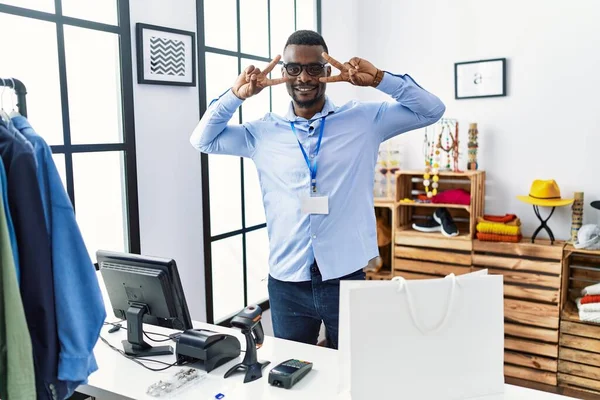Young African Man Working Manager Retail Boutique Doing Peace Symbol — Stok fotoğraf