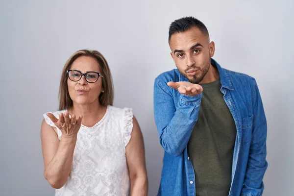 Hispanic Mother Son Standing Together Looking Camera Blowing Kiss Hand — Stockfoto