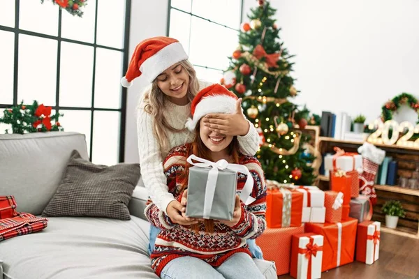 Woman Couple Surprise Gift Sitting Christmas Tree Home — Φωτογραφία Αρχείου
