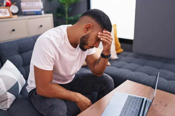 Young Latin Man Stressed Using Laptop Sitting Sofa Home — Stock Photo, Image