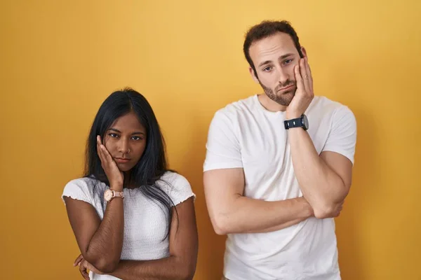 Interracial Couple Standing Yellow Background Thinking Looking Tired Bored Depression — Foto Stock