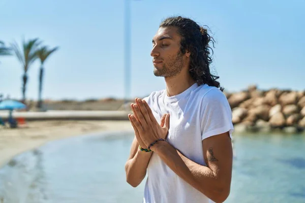 Young Hispanic Man Doing Yoga Exercise Standing Beach — Foto de Stock
