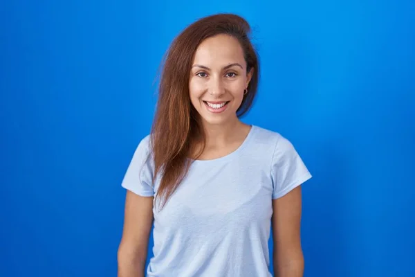 Brunette Woman Standing Blue Background Happy Cool Smile Face Lucky — Zdjęcie stockowe