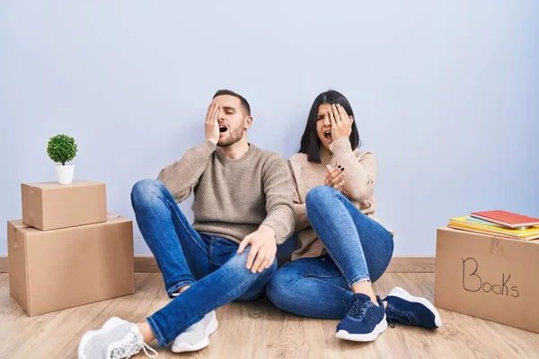 Young Couple Moving New Home Yawning Tired Covering Half Face — Stock Photo, Image