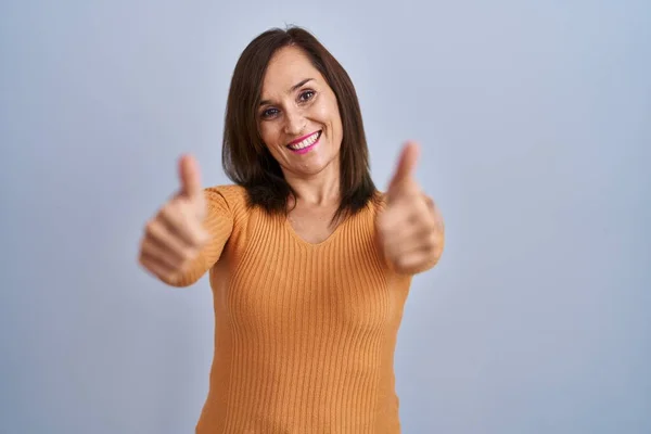 Middle Age Brunette Woman Standing Wearing Orange Sweater Approving Doing — Photo