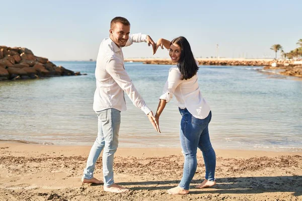 Man Woman Couple Smiling Happy Doing Heart Symbol Arms Seaside — Stock fotografie