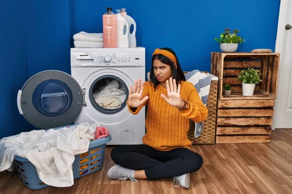 Young Hispanic Woman Doing Laundry Moving Away Hands Palms Showing — Stock Photo, Image
