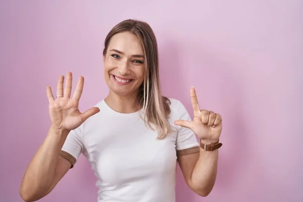 Blonde Caucasian Woman Standing Pink Background Showing Pointing Fingers Number — Stock Photo, Image