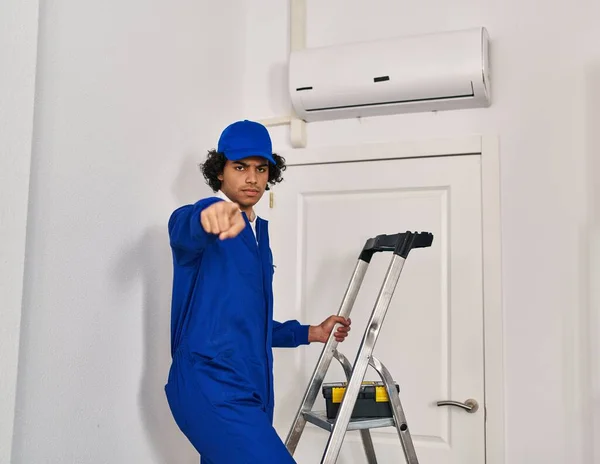 Hispanic Man Curly Hair Working Home Renovation Pointing Finger Camera — Stock Photo, Image