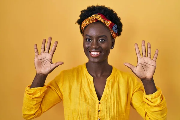 African Young Woman Wearing African Turban Showing Pointing Fingers Number — Stock Photo, Image