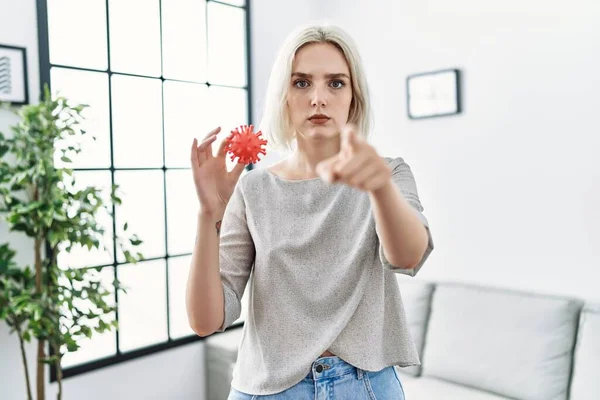 Young Caucasian Woman Holding Virus Toy Pointing Finger Camera You — Stockfoto