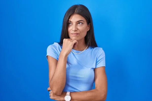 Brunette Young Woman Standing Blue Background Looking Stressed Nervous Hands — Stockfoto