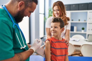 Family vaccinating child having medical consultation at clinic