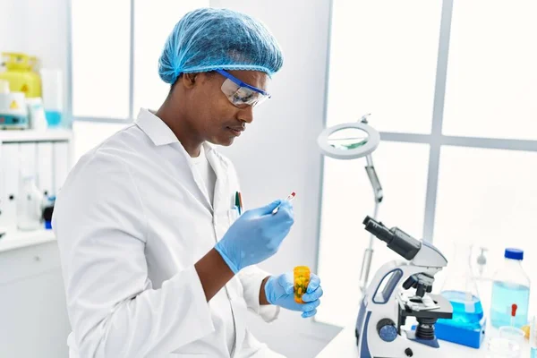 Young South East Man Wearing Scientist Uniform Holding Pill Laboratory — Foto de Stock
