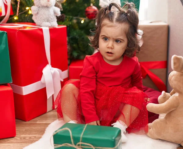 Adorable Hispanic Girl Sitting Floor Christmas Tree Home — Stok fotoğraf