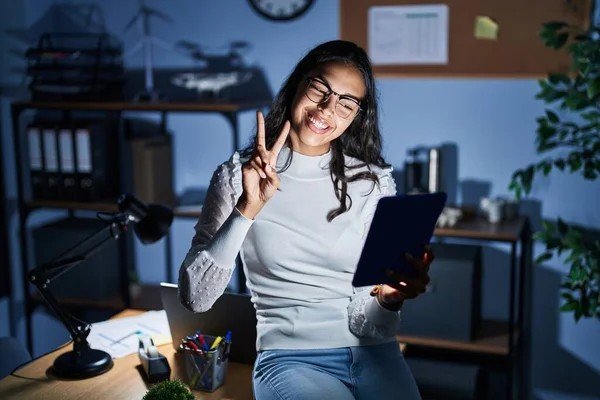 Young Brazilian Woman Using Touchpad Night Working Office Smiling Looking —  Fotos de Stock