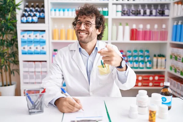 Hispanic Young Man Working Pharmacy Drugstore Pointing Fingers Camera Happy — Fotografia de Stock
