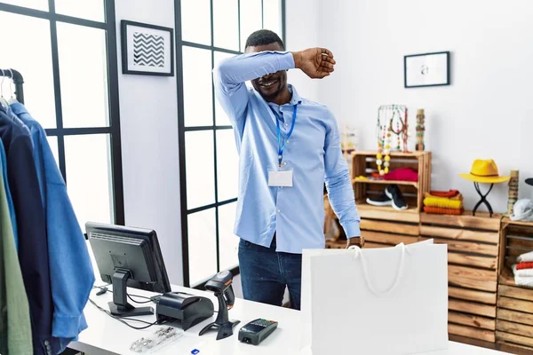 Young African Man Working Manager Retail Boutique Covering Eyes Arm — Stok fotoğraf