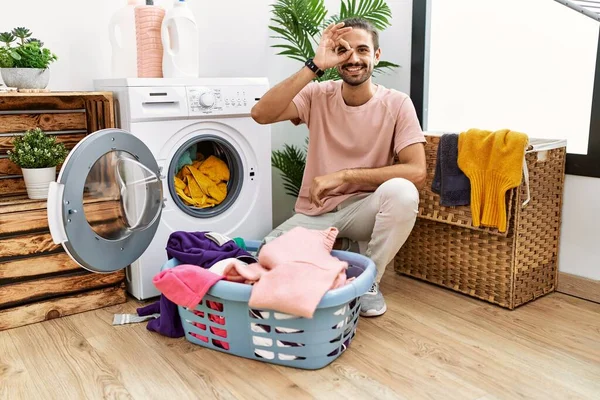 Young Hispanic Man Putting Dirty Laundry Washing Machine Smiling Happy — Fotografia de Stock