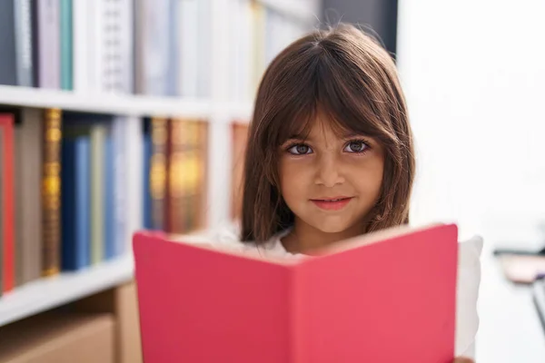 Adorable Hispanic Girl Student Smiling Confident Reading Book Classroom — ストック写真