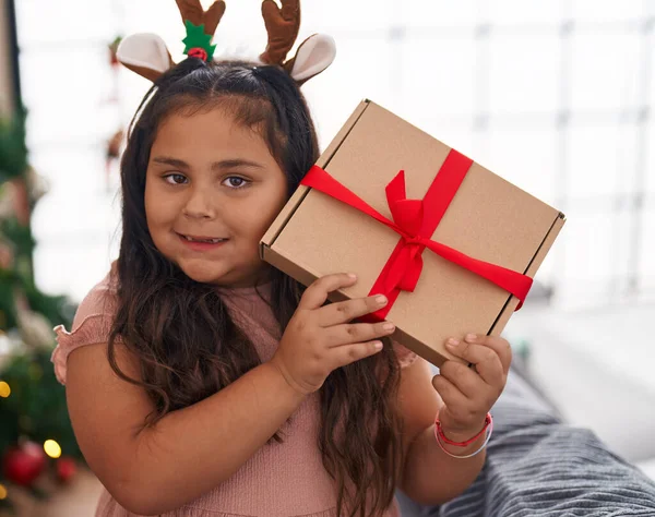 Size Hispanic Girl Hearing Gift Sound Standing Christmas Tree Home —  Fotos de Stock