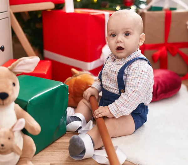 Adorable Caucasian Baby Holding Horse Toy Sitting Floor Christmas Tree — Stock Photo, Image