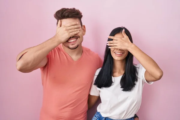 Young Hispanic Couple Standing Pink Background Smiling Laughing Hand Face — Stockfoto