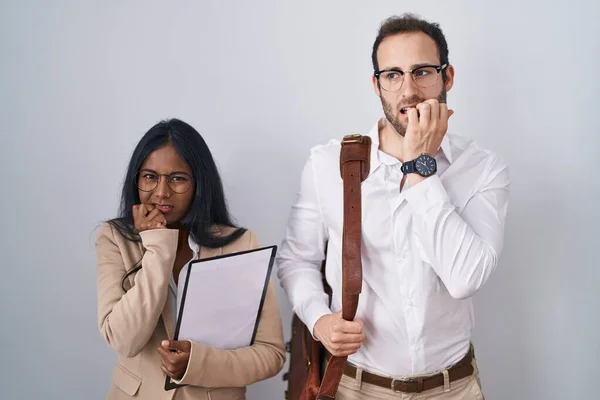 Interracial Business Couple Wearing Glasses Looking Stressed Nervous Hands Mouth — Foto de Stock