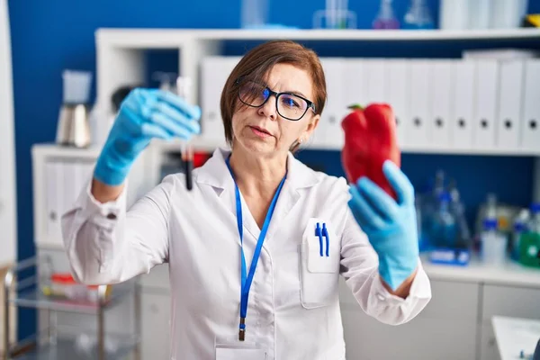 Middle Age Woman Scientist Holding Pepper Blood Test Tube Laboratory — Stock Photo, Image