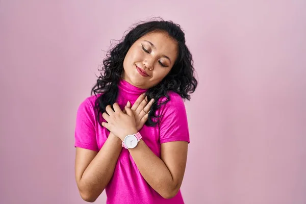 Young Asian Woman Standing Pink Background Smiling Hands Chest Closed — 图库照片