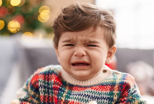 Adorable Hispanic Toddler Sitting Sofa Christmas Tree Crying Home — Stock Photo, Image